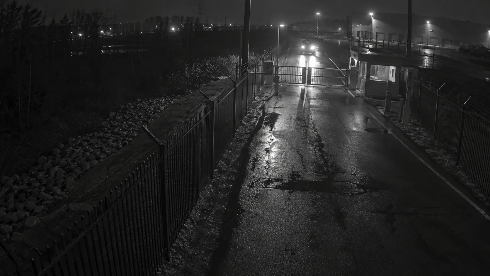 Low-light fixed camera view of an anonymous access road